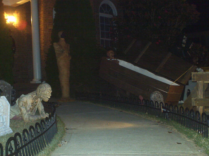 Night View of Halloween Graveyard Crawling Ghoul Egyptian Mummy Corpse in Coffin