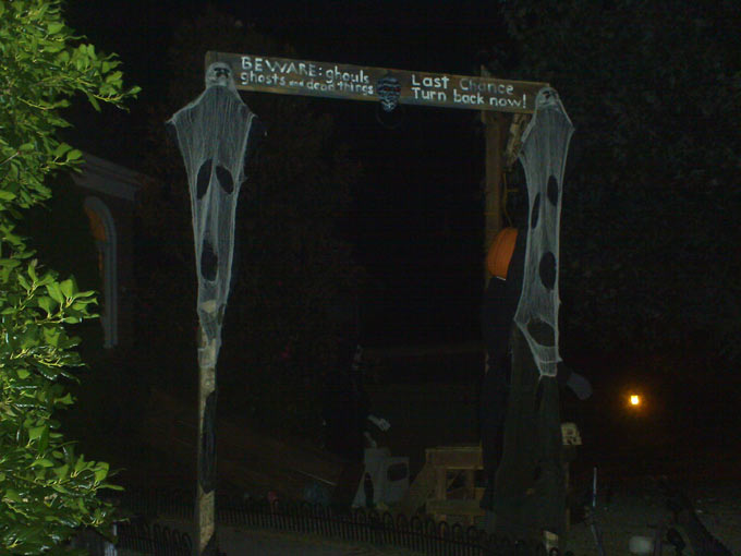 Night View of Halloween Graveyard Entrance Banner