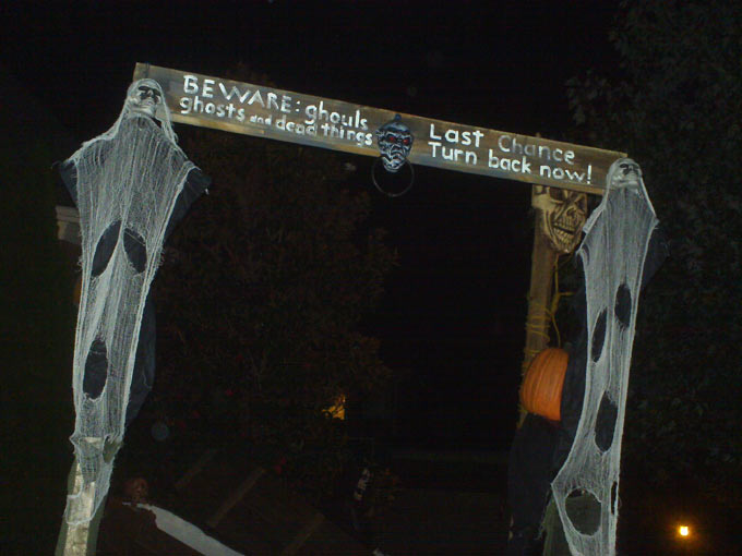 Nighttime  View of Halloween Graveyard Entrance Banner